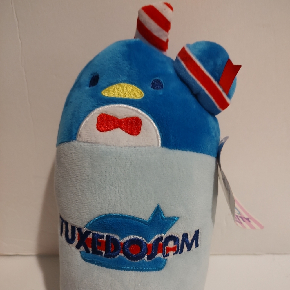 Embrace the charm of Sanrio with this delightful Hello Kitty TuxedoSam plush. 